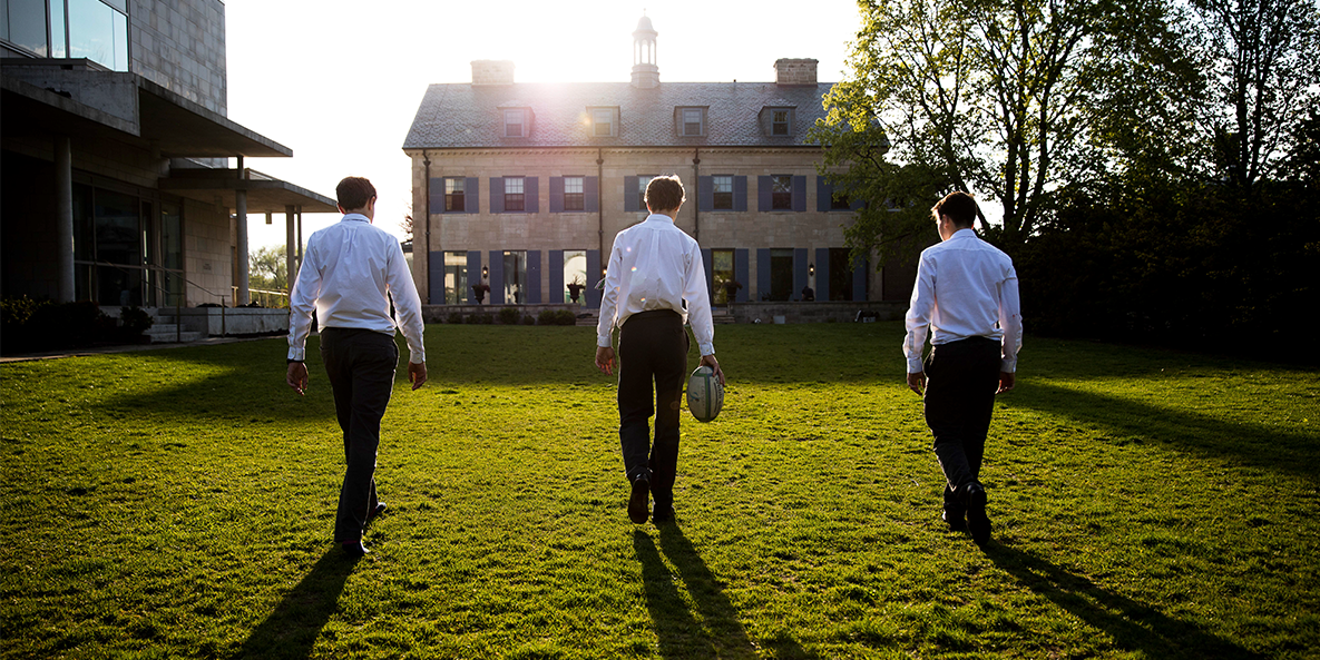 Student walking towards the Manor